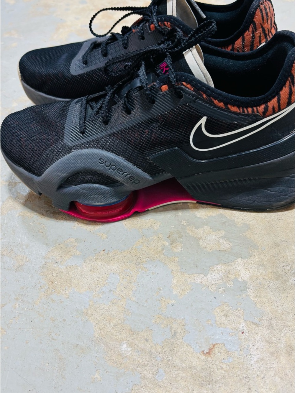 Nike Women’s Black Training Shoes with Pink and Orange Accents